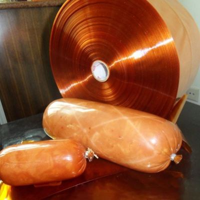 30-350 mm de ancho plano PVDC Película de carcasa de salchicha de plástico Resistente al calor hasta 90 ° C para el embalaje de salchichas
